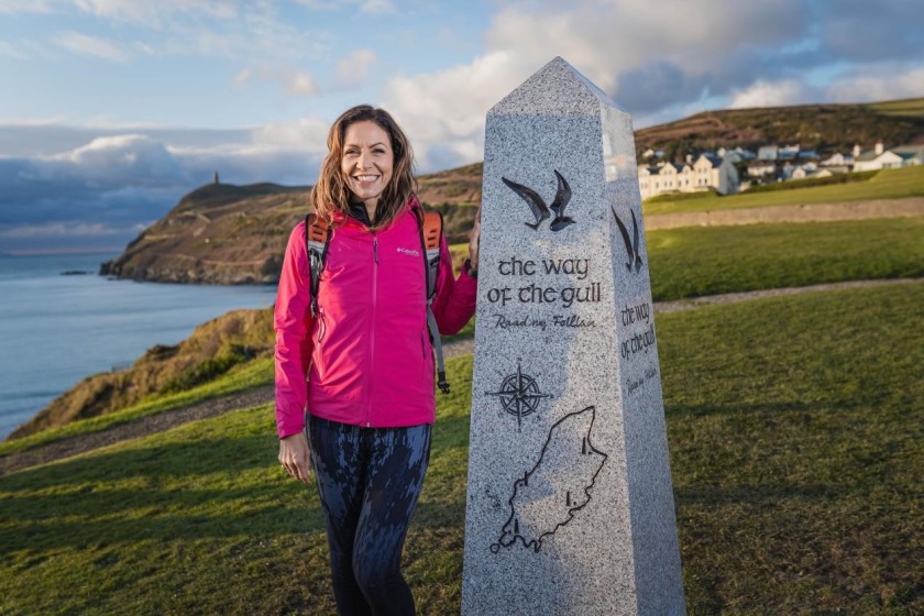 Julia Bradbury unveiling the first of four granite start-markers installed at Bradda Hiar, Port Erin.